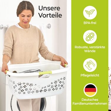 Premium laundry basket 50 L with ergonomic shape, soft-touch handles, breathable design, and decorative floral pattern (white/mint green)
