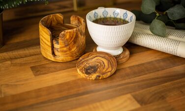 Set of 6 round beer coasters made of olive wood, 8.5 cm in diameter, including storage box. Suitable for glasses, mugs, cups, and vases.