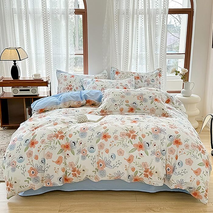 Блискуча постільна білизна Bunt Blumen з бавовни 100x135 см. Комплект для дитячого ліжка: простирадло, ковдра та подушка з квітковим малюнком.