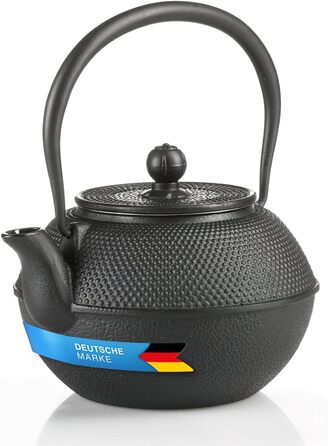Asian cast iron teapot. Traditional iron teapot.