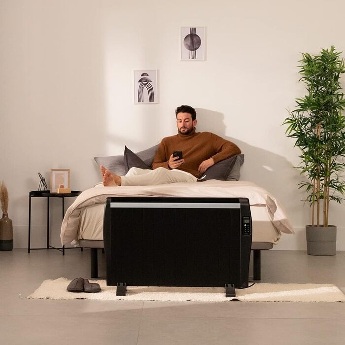 Cecotec ReadyWarm 2500 Thermal Black Flat Radiator with Remote Control. 12 heating ribs and 1800W, LCD display, programmable timer, temperature selection, 25 m² range, and maximum safety with 12 black elements.