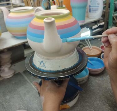 Hand-painted sugar bowl and teapot set with rainbow stripes