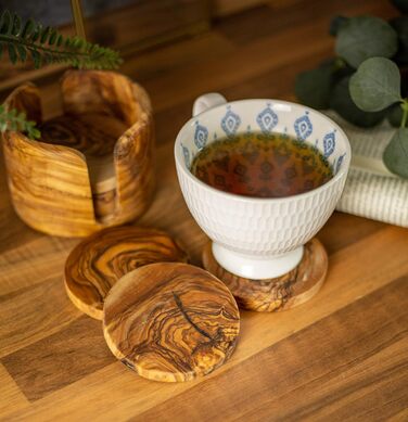 Set of 6 round beer coasters made of olive wood, 8.5 cm in diameter, including storage box. Suitable for glasses, mugs, cups, and vases.