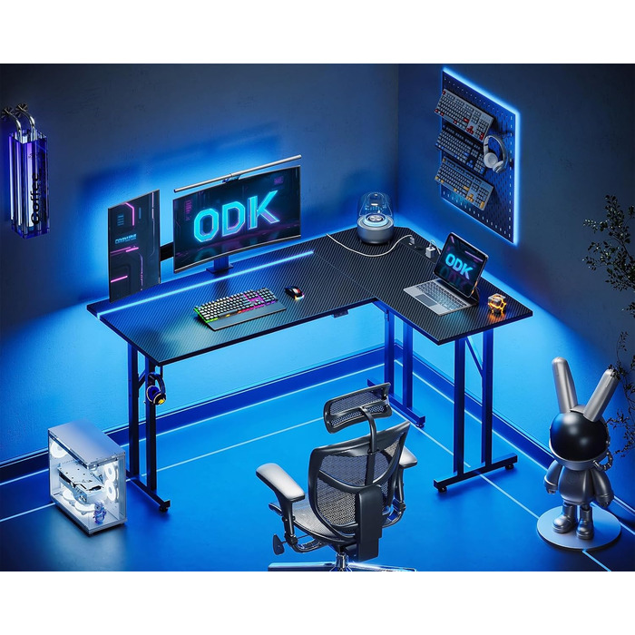 Ігровий стіл ODK L-подібний з LED та розеткою, комп'ютерний стіл з гачком для навушників, кутовий письмовий стіл для дому, карбон, чорний, 130×90 см