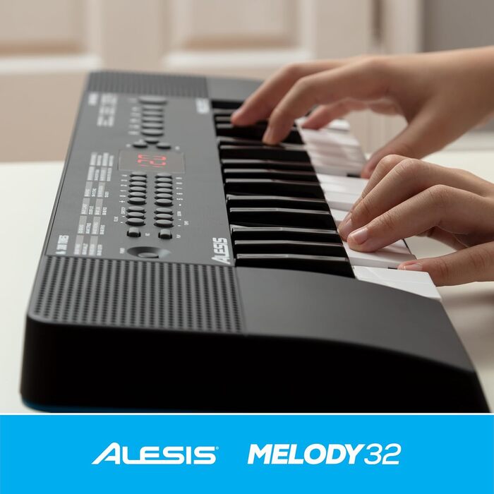 Alesis Melody 54 - Портативна клавіатура з 54 клавішами, вбудованими динаміками, 300 звуками, 300 ритмами, 40 демо-піснями, навчальними інструментами, мікрофоном та підставкою для нот (32 клавіші)
