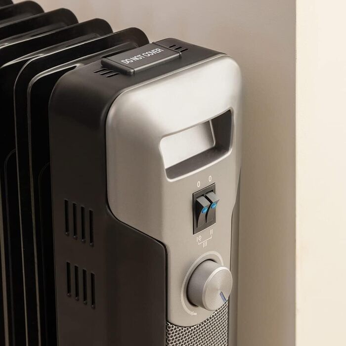 Електричний масляний радіатор Cecotec ReadyWarm 11000 Space - 2500 Вт, 11 ребер обігріву, 3 режими, 25 м², з кабелеутримувачем, ручкою та колесами (білий/чорний, 2000 Вт)